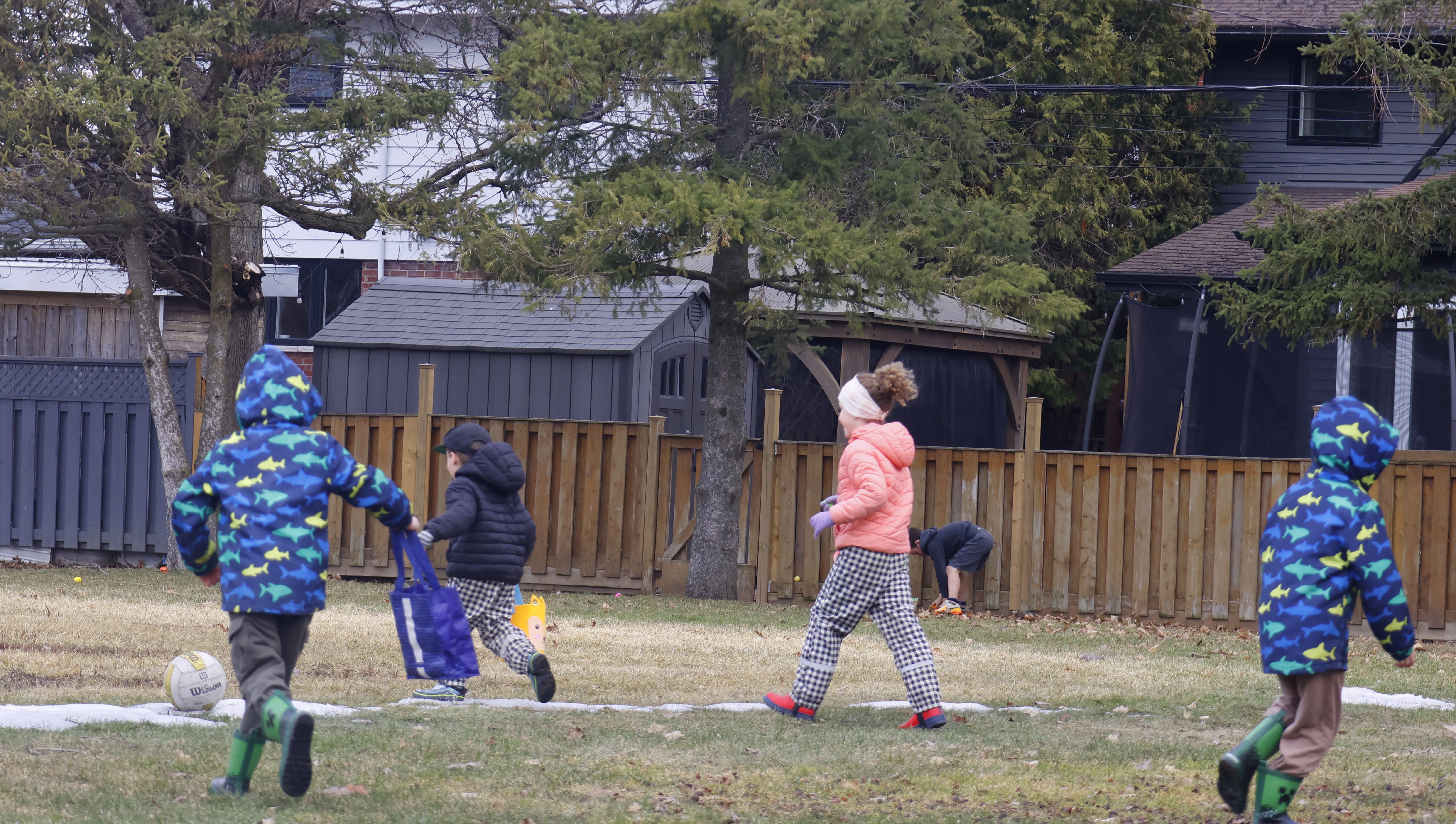 Children looking around the park for some easter treats.